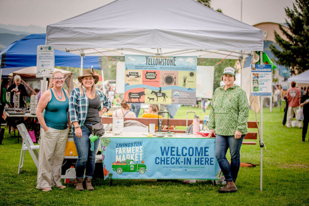 Team members at the Livingston Farmers Market booth